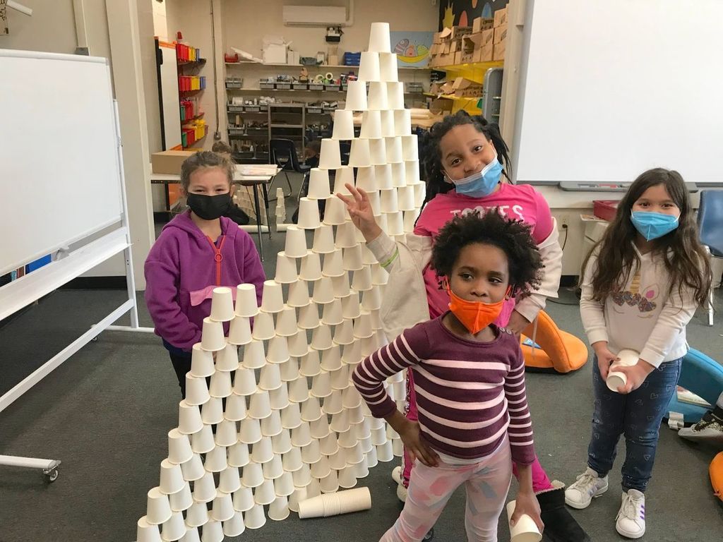 Wilkins School students working on a cup pyramid