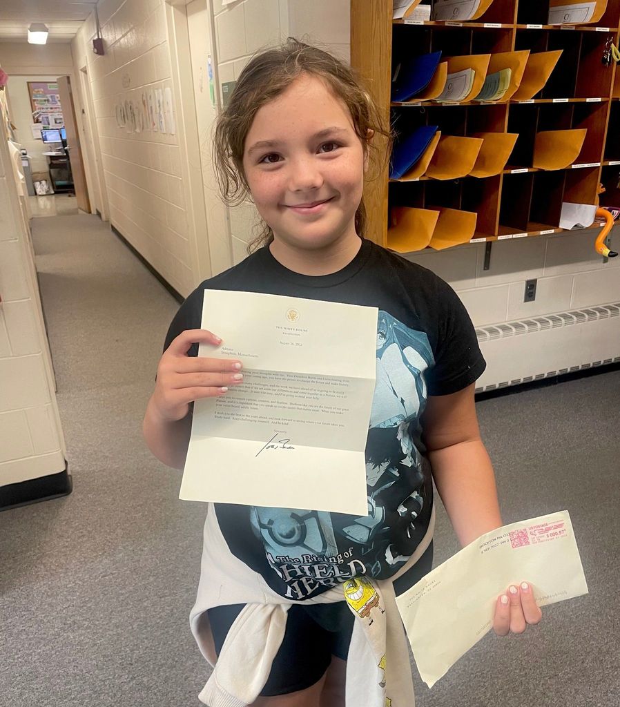 Dawe School Student with a letter from the President