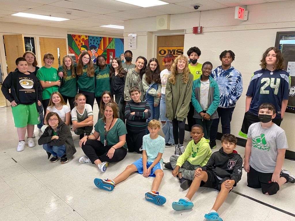 OMS students wearing green for Start With Hello Week